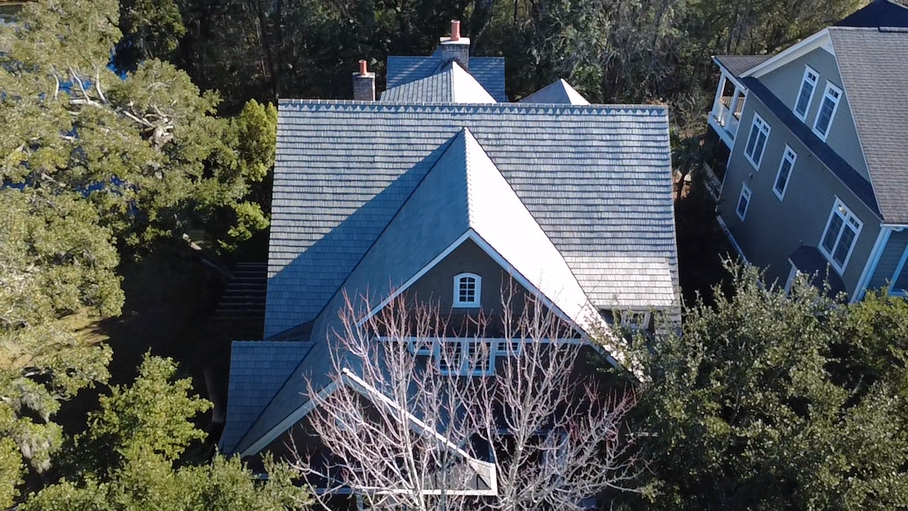Aerial view of a house's complex roof.